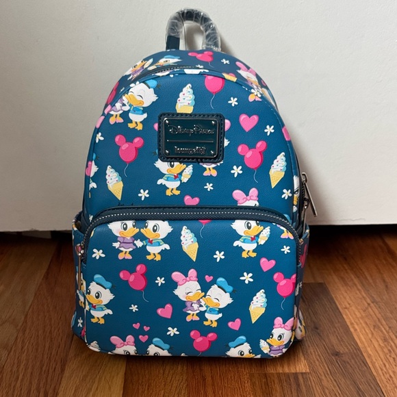 Loungefly Handbags - Loungefly Disney Parks Exclusive Donald & Daisy Mini Backpack